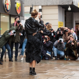 Elena Perminova surrounded by photographers during London Fashion Week